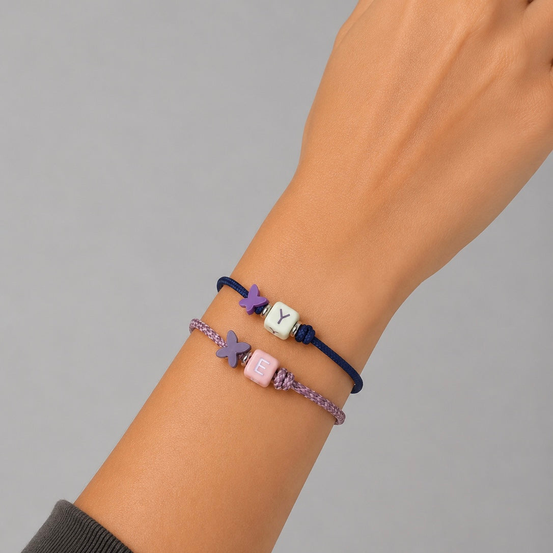 Pack 5 Pulseras letrita con mariposa plata